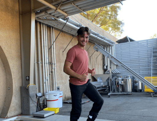 Male vintage staff foot crushing grapes